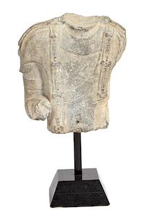 A Chinese Carved Stone Torso Fragment Height of fragment 11 x width 10 inches.