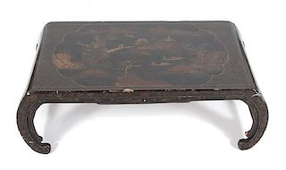 A Chinese Export Gilt-Decorated Black Lacquer Low Table Height 12 1/2 x width 38; depth 19 1/2 inches.