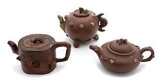 Three Japanese Terracotta Teapots Height of largest 6 inches.