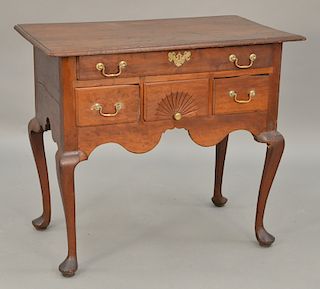 Queen Anne lowboy with molded top over one long drawer over three short drawers with fan carved center drawer over cyma skirt, all s...