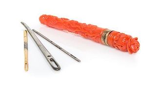 A Carved Coral Needle Case, Length 3 1/4 inches.