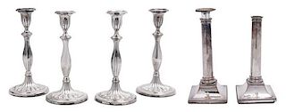 A Pair of Sheffield Plate Columnar Candlesticks and a Set of Four English Silverplate Candlesticks