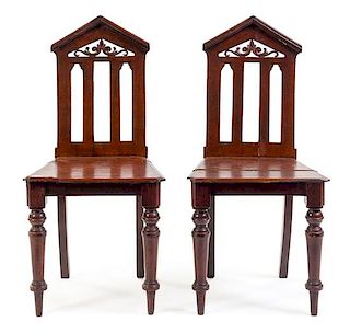 A Pair of Regency Style Grain-Painted Hall Chairs Height 36 inches.