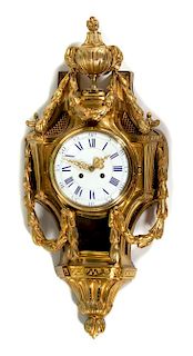 A Louis XV Style Gilt Bronze Cartel Clock Height 27 1/2 x width 12 1/2 inches.