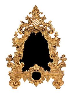 An Elaborate Rococo Style Giltwood Mirror