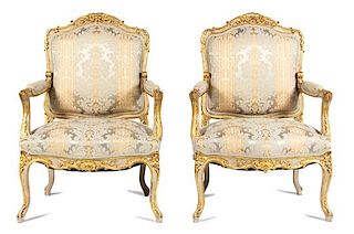 A Set of Four Louis XV Style Parcel-Gilt and Painted Fauteuils Height 41 1/2 inches.