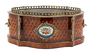 A Louis Philippe Porcelain-Mounted Parquetry Cartouche-Form Jardiniere Height 7 inches x width 17 x depth 10 3/4 inches.