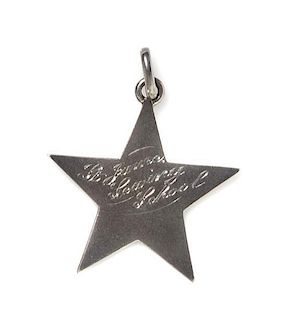 An American Metal Presentation Charm, Height 1 1/4 inches.