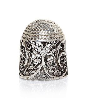 A Silver Filigree Thimble, Height 5/8 inch.