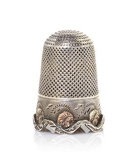 A Silver and Vari-Color Gold Thimble, Height 1 inch.