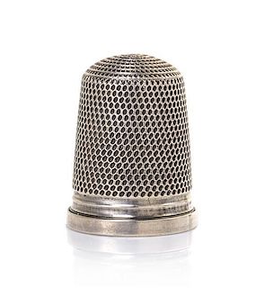 An English Silver Thimble, Height 15/16 inch.