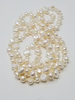 Strand of White Freshwater Pearls - 60 in.