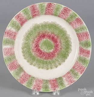 Red and green spatterware bull's-eye plate, 19th c., 9 1/2'' dia.
