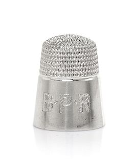 An American Platinum Thimble, Height 3/4 inch.