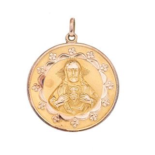 Medalla rellena en oro amarillo de 10k. Imagen del Sagrado corazon de Jesús y Virgen de Guadalupe. Peso: 10.6 g.