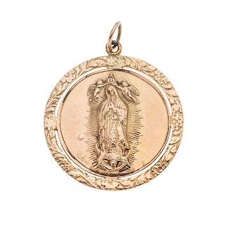 Medalla en oro amarillo de 10K. Imagen de la virgen de Guadalupe. Peso: 4.8 g.