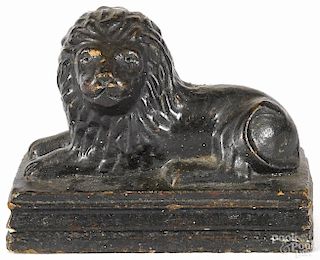 Sewer tile figure of a recumbent lion, 19th c., resting on a molded plinth, 7 1/2'' h., 9 1/2'' w.