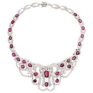 A ruby and diamond 18K white gold choker, ring and pair of earrings set.