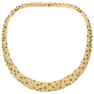 An emerald and diamond 18K yellow gold choker.