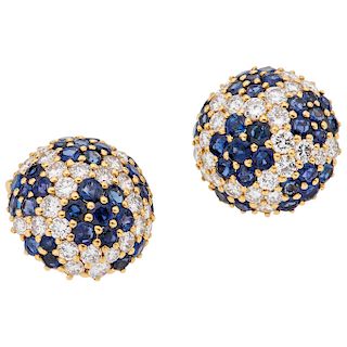A sapphire and diamond 18K yellow gold pair of earrings.