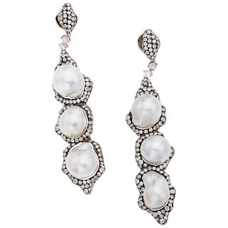 A cultured pearl and diamond 18K white gold pair of earrings.