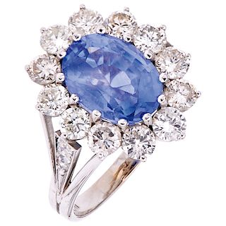 A sapphire and diamond 14K white gold ring.