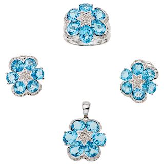 A topaz and diamond 14K white gold pendant, ring and pair of earrings set.