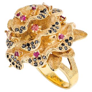 A diamond, ruby and sapphire 18K yellow gold ring.