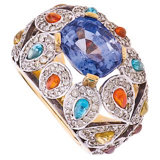 A sapphire and diamond yellow and white gold ring.