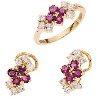 A ruby and diamond 18K yellow gold ring and pair of earrings set.