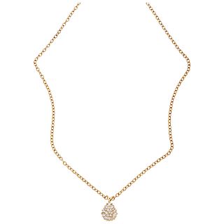 A diamond 14K yellow gold pendant and necklace.