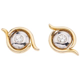 A diamond 14K yellow and white gold pair of earrings.