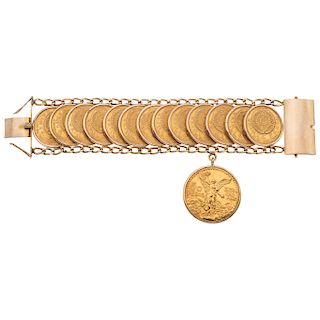 A 14K yellow gold bracelet with 21.6K yellow gold coins.