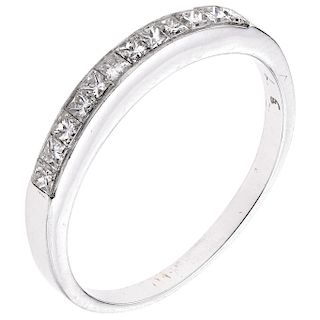 A diamond 14K white gold half eternity ring.