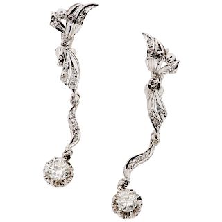 A diamond palladium silver pair of earrings.