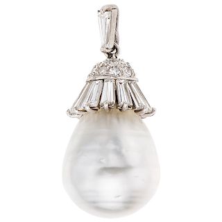 A cultured pearl and diamond 14K white gold pendant.