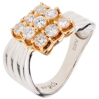 A diamond platinum and 18K yellow gold ring.