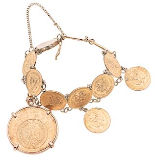 A 10K yellow gold bracelet with 21.6K yellow gold coins.