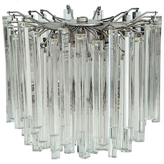 PAOLO VENINI. Años 60. Candil. Estructura de acero y cristal Murano transparente. Diseño a manera de prismas. Firmado.