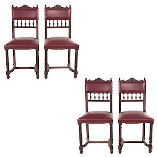 Lote de 4 sillas. Francia. Siglo XX. Estilo Enrique II. En talla de madera de roble. Con tapicería de piel color rojo.