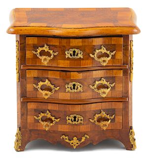 A Continental Parquetry and Gilt Metal Mounted Diminutive Commode