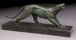 Patinated bronze figure of a panther raised on a