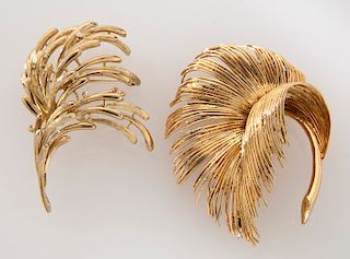 (2) 18K gold flora-form brooches.