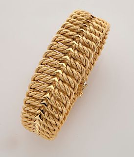 18K yellow gold woven design bracelet.