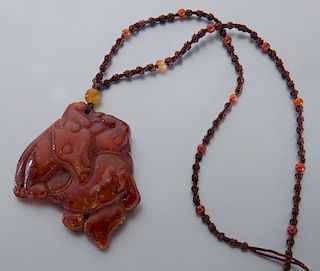 Chinese Ming carved amber pendant,