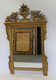 Carved And Giltwood Mirror With Urn Form Crown