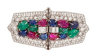 A Pair of Art Deco Platinum, Diamond, Ruby, Sapphire, and Emerald Double Clip Brooches, 23.40 dwts.