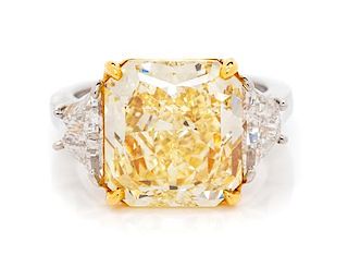 A Platinum, 18 Karat Yellow Gold, Fancy Intense Yellow Diamond, and Diamond Ring, 5.90 dwts.