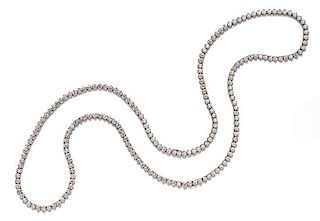 A Pair of Platinum and Diamond Convertible Riviere Necklaces, 66.30 dwts.