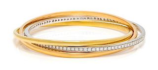 An 18 Karat Tricolor Gold and Diamond Triple Rolling Bangle Bracelet, Garavelli Aldo, 37.60 dwts.